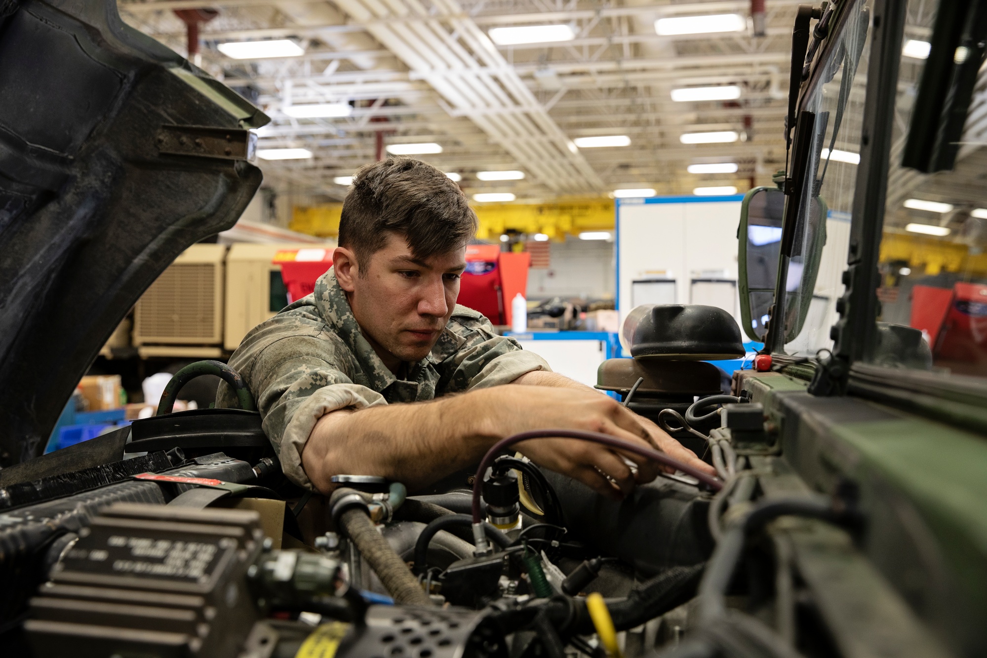 DVIDS Images Alaska Army National Guard mechanic works on vehicle