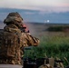Battle Group Poland's Poacher Troop fires and maneuvers to practice reconnaissance tactics