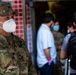 Afghan evacuees guided to processing during Operation Allies Welcome at Fort Pickett, Virginia.