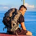 Staff Sgt. Brandon Stubbs sits to recover after a physically taxing hike to the Ma'ili Pillboxes.