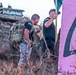 Sgt. First Class Javier Cardenas(right) and Staff Sgt. Robert Darden(left, with Guidon) admires the view of the shores by the Ma'ili Pillboxes.