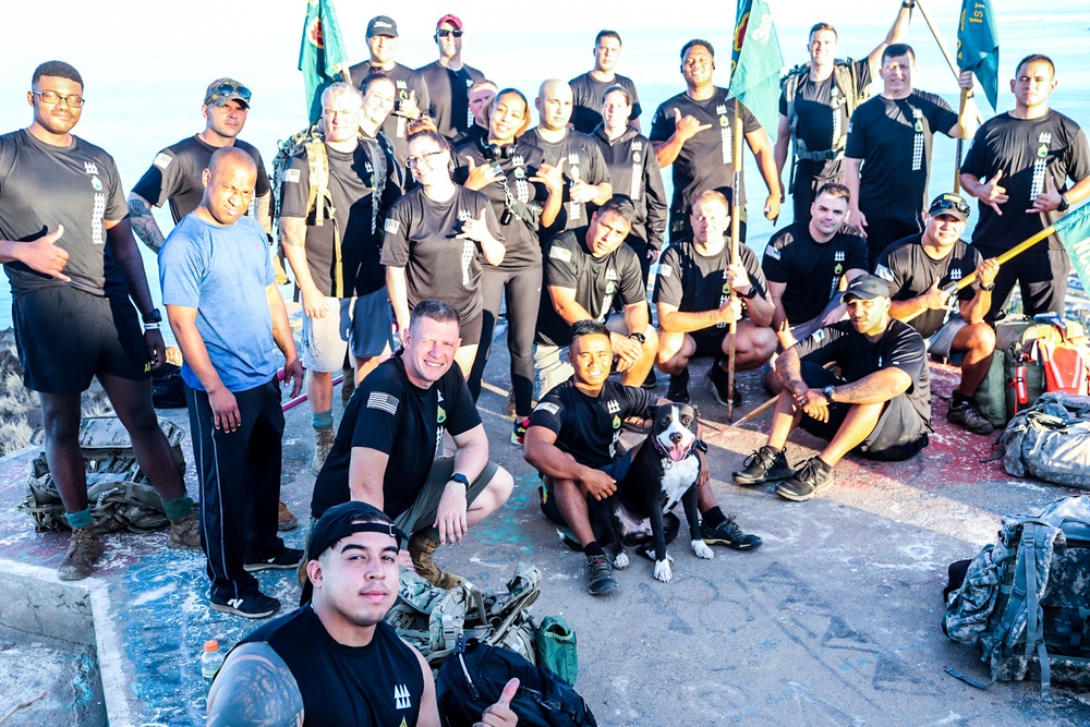 Soldiers assigned to the NCO Academy-Hawaii pose for a photo as they have completed the Ma'ili Pillbox Hike.