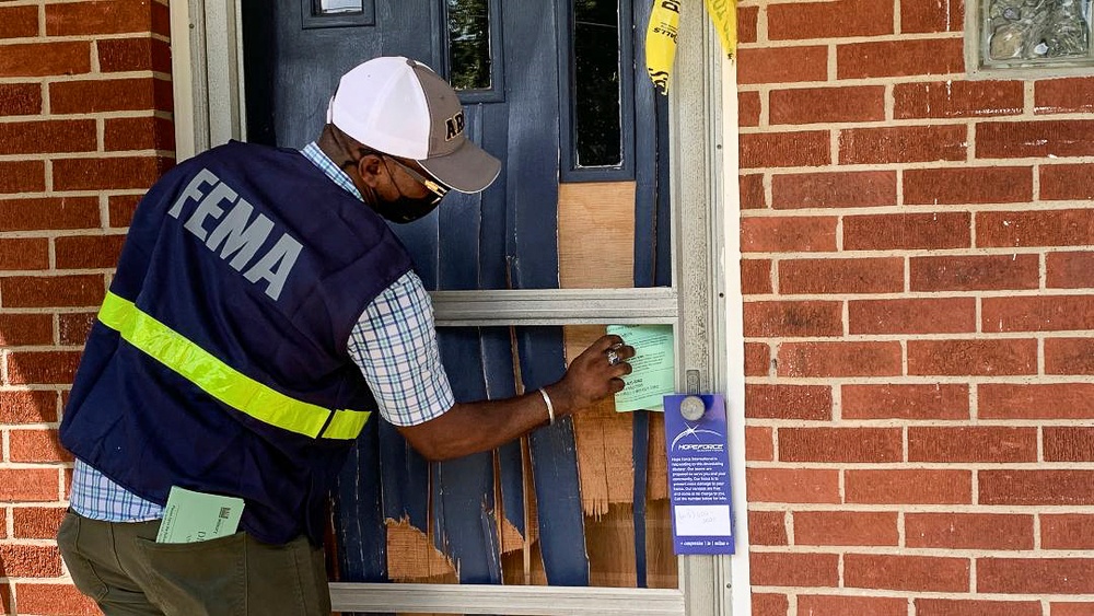 FEMA in the Neighborhood Leaving Information at the Door