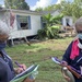 FEMA Comparing Data While Canvassing Hard Hit Community