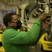 USS Carl Vinson (CVN 70) Sailor Conducts Maintenance