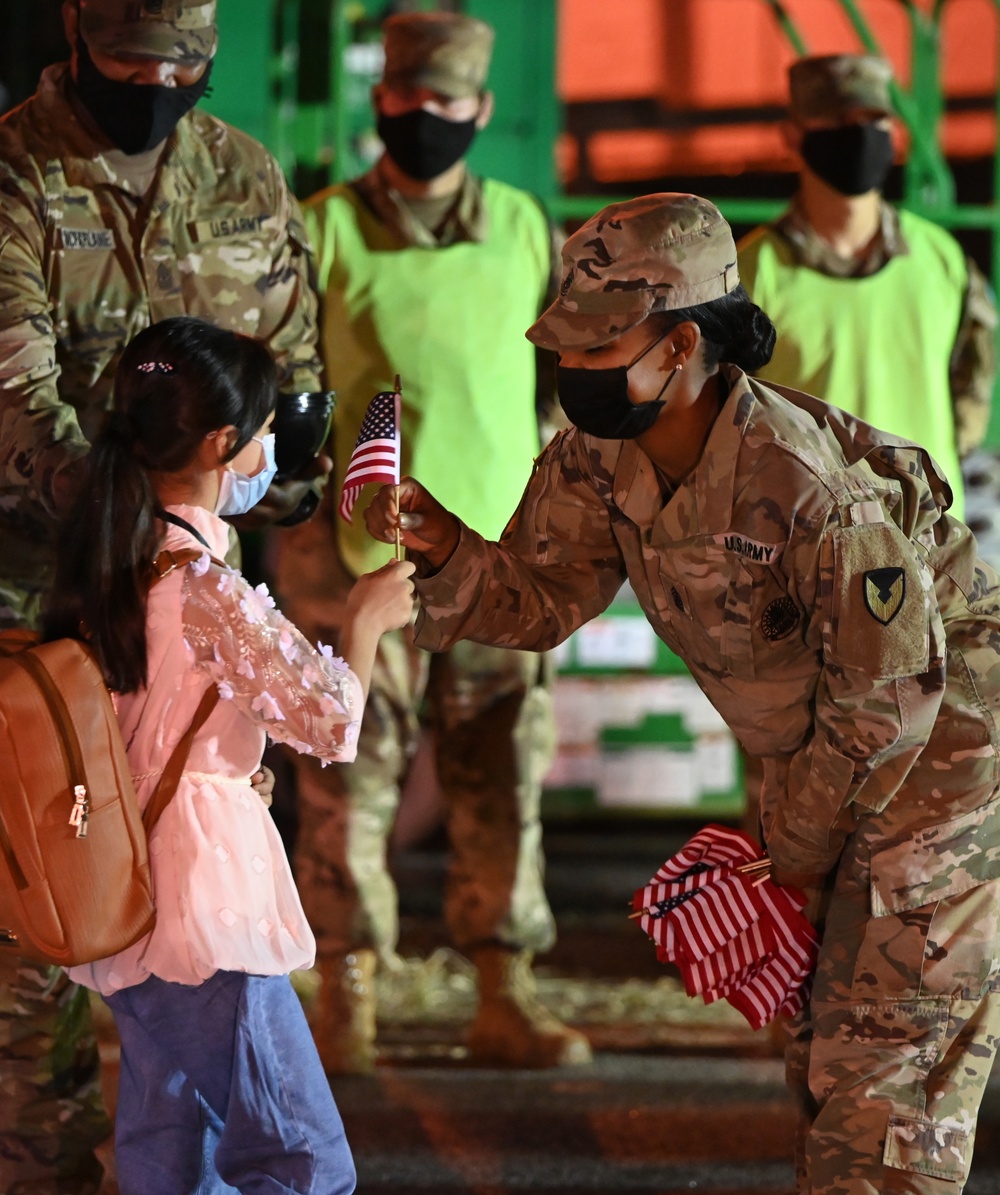 Ft. Lee Garrison Command Sgt. Maj., Command Sgt. Maj. Tamisha Love welcomes Afghan children to Ft. Lee