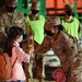 Ft. Lee Garrison Command Sgt. Maj., Command Sgt. Maj. Tamisha Love welcomes Afghan children to Ft. Lee