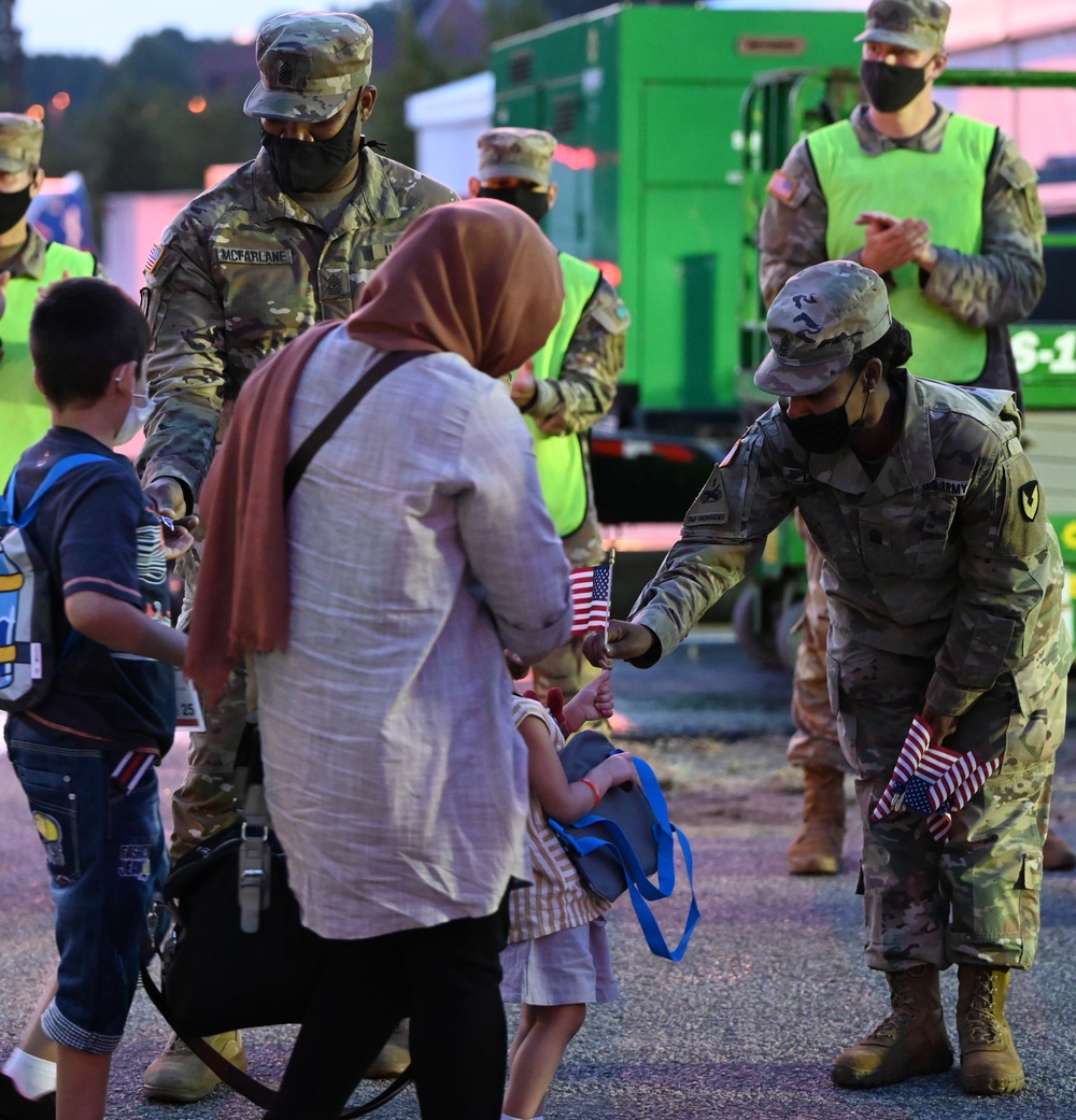 Fort Lee Garrison Command Sgt. Maj., Command Sgt. Maj. Tamisha Love welcomes Afghan children to Fort Lee