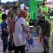 Fort Lee Garrison Command Sgt. Maj., Command Sgt. Maj. Tamisha Love welcomes Afghan children to Fort Lee