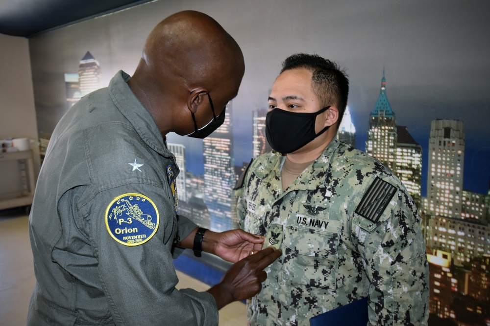 Rear Adm. Stephen Barnett frocks Sailor