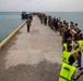 Sailors And Marines Create An Assembly Line With Haitians To Deliver Humanitarian Aid in Jérémie, Haiti