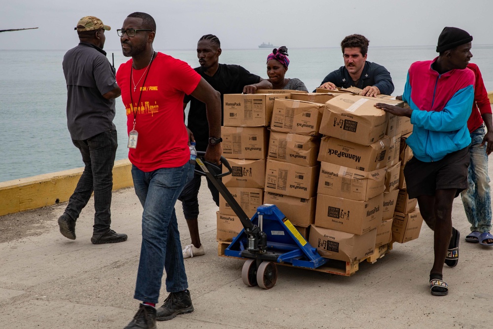 Sailor Assists Haitians Move Humanitarian Aid