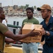 U.S. Navy Sailor Returns Home To Assist In Humanitarian Mission