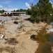 The Creek That Was Blocked With Debris Causing the Flooding