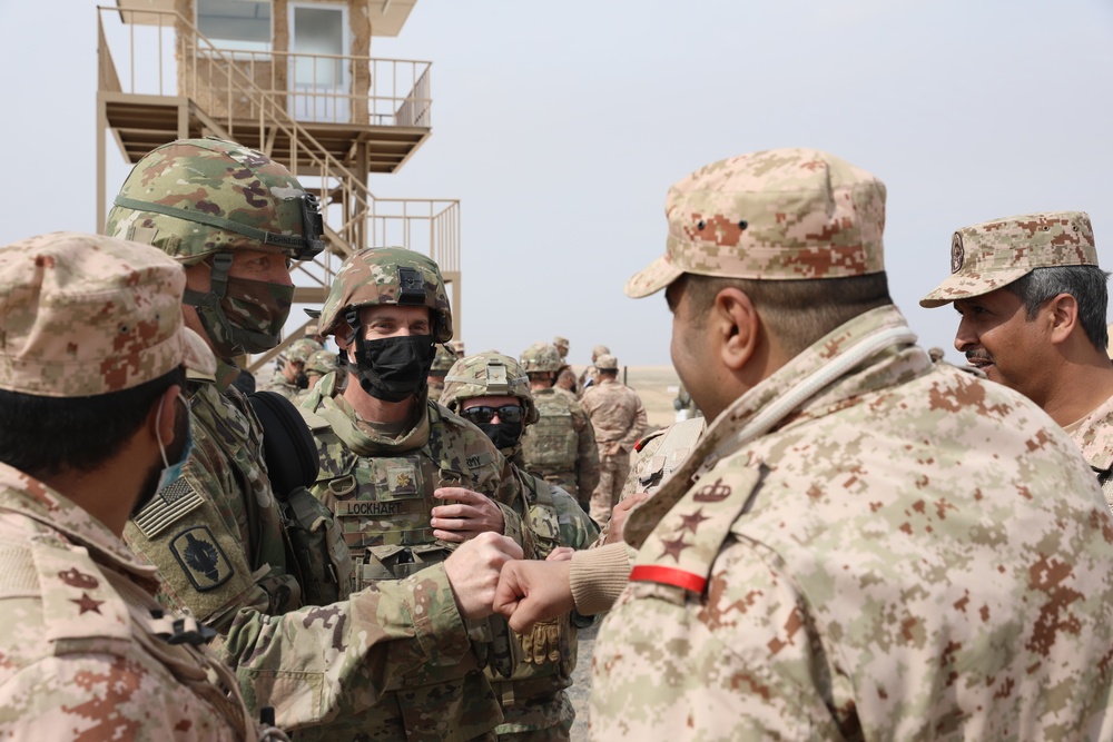 Col. Paul Schneider of the 130th Field Artillery Brigade meets host nation leaders at Kuwaiti Liberation live fire event