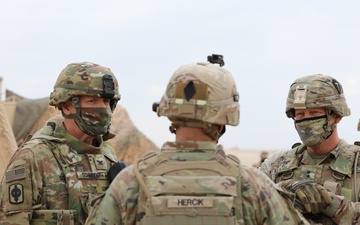 Col. Paul Schneider of the 130th Field Artillery Brigade meets with other U.S. military leaders at the Kuwaiti Liberation live fire event