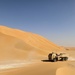 High Mobility Artillery Rocket System traveling through desert