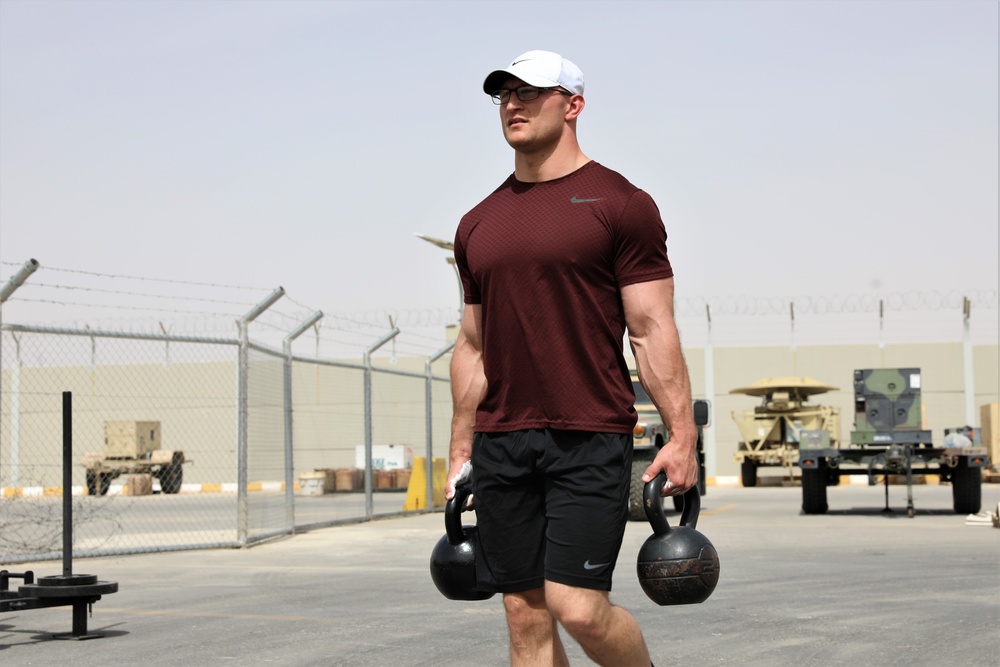 Members of the 130th Field Artillery Brigade compete in the Strong Man/Woman Competition