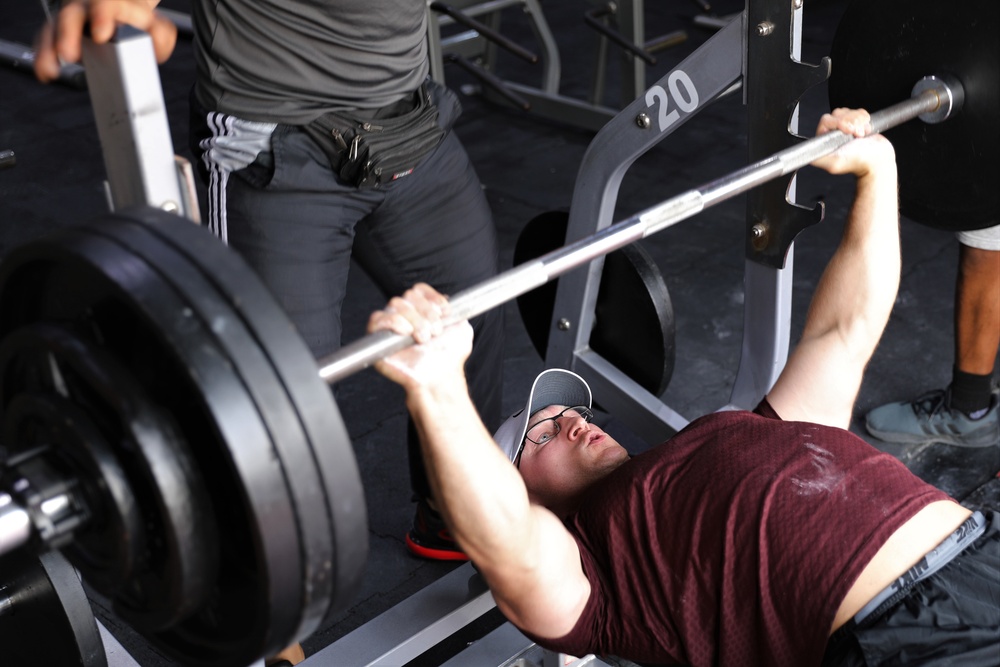 Members of the 130th Field Artillery Brigade compete in the Strong Man/Woman Competition