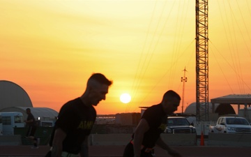 Soldiers run at sunset during the ACFT