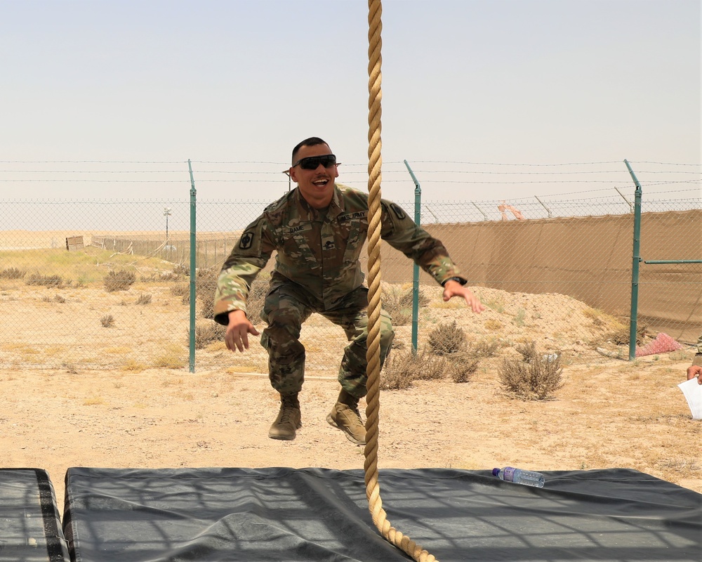 Spc. Christopher Dame begins the obstacle course during the Task Force Spartan best warrior competition in Kuwait