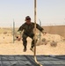 Spc. Christopher Dame begins the obstacle course during the Task Force Spartan best warrior competition in Kuwait