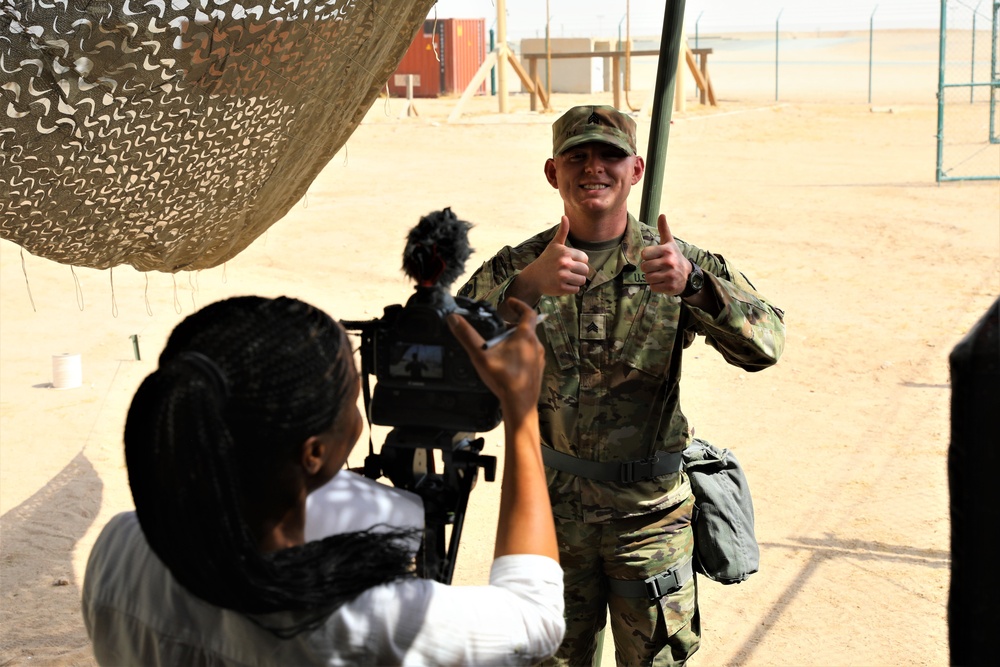 Sgt. Erik Wold completes a public affairs mock interview during the Task Force Spartan best warrior competition in Kuwait