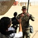 Sgt. Erik Wold completes a public affairs mock interview during the Task Force Spartan best warrior competition in Kuwait