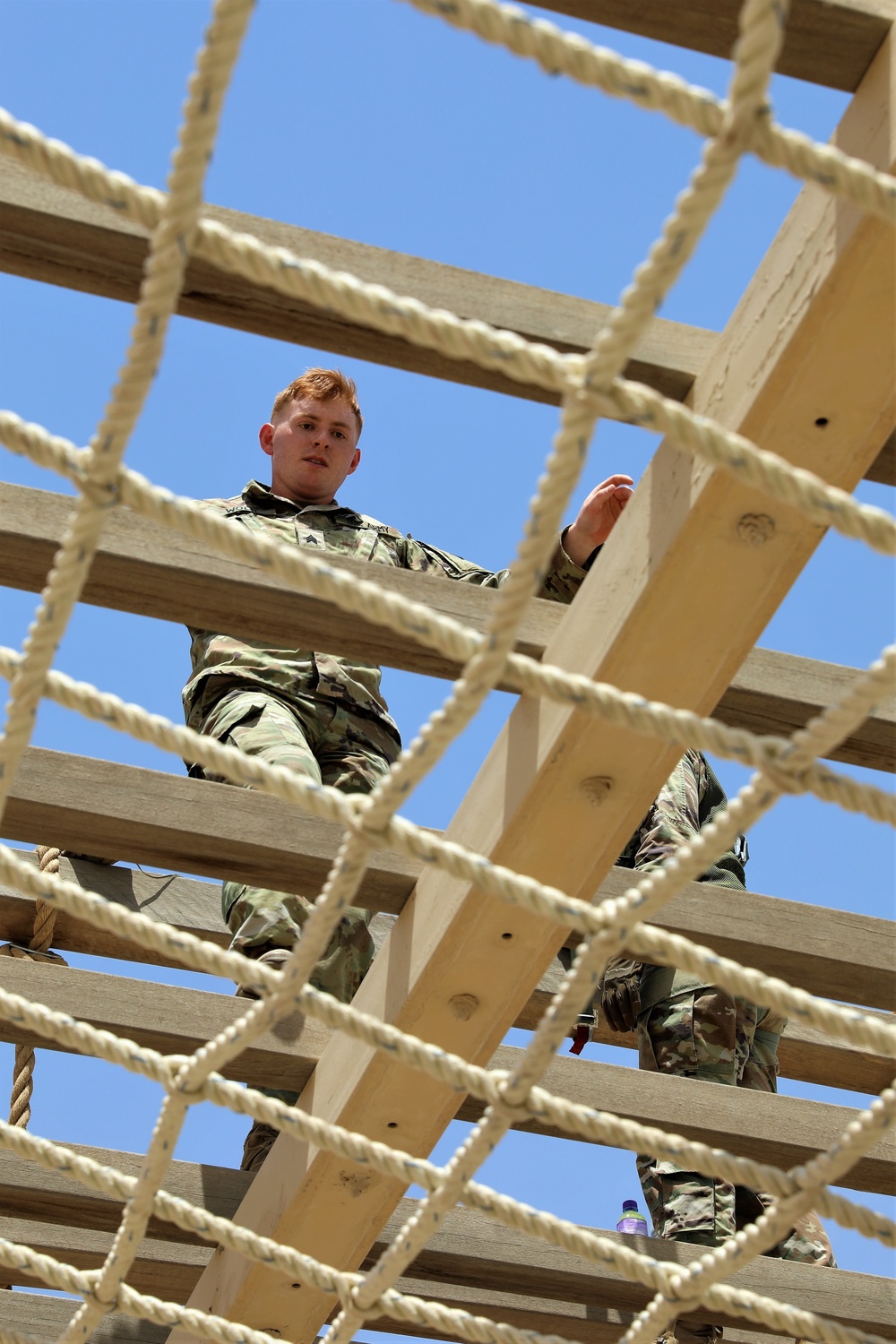 Sgt. Erik Wold completes the obstacle course during the Task Force Spartan best warrior competition in Kuwait