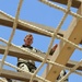 Sgt. Erik Wold completes the obstacle course during the Task Force Spartan best warrior competition in Kuwait