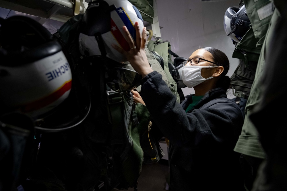 USS Carl Vinson (CVN 70) Sailor Inspects Aircrew Equipment