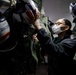 USS Carl Vinson (CVN 70) Sailor Inspects Aircrew Equipment