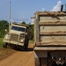 National Guard Trucks Transporting Debris To Landfill