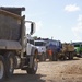 Truck With Debris Lined-Up to Enter Landfill