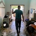 Church Member Helping Muck Out Building Offers Praise