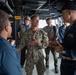 Rear Adm. Davids Speaks with Capt. Eric Kellum on the Bridge Of USS Arlington