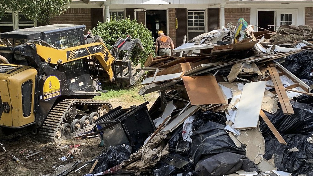 Southern Baptist Disaster Relief Volunteers Pile Debris at Curb