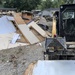 Wall Paneling Being Removed From Flood Damaged House