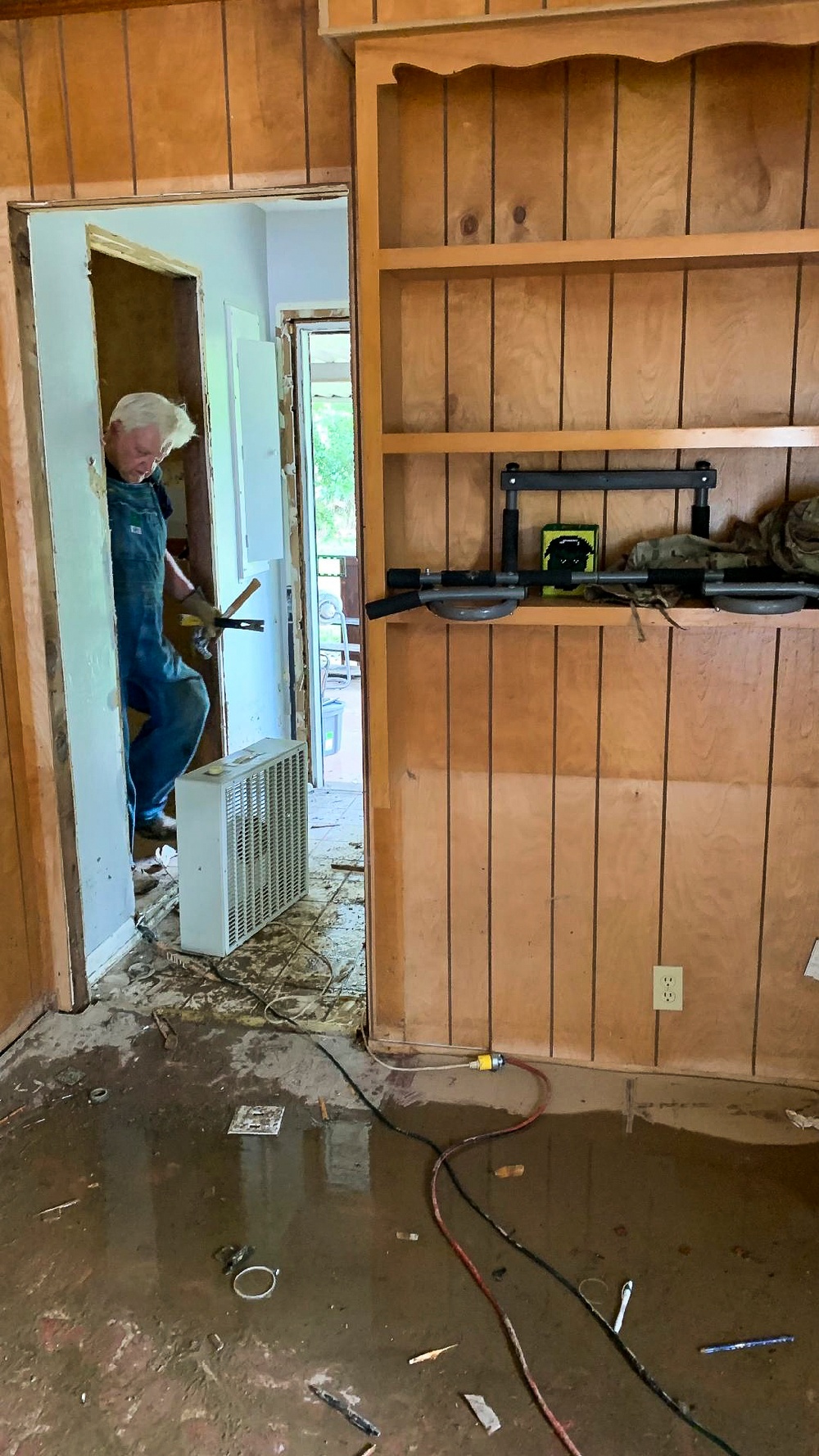 Southern Baptist Volunteer Mucking Out A Flooded House