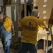 Volunteers Break Down Damaged Walls