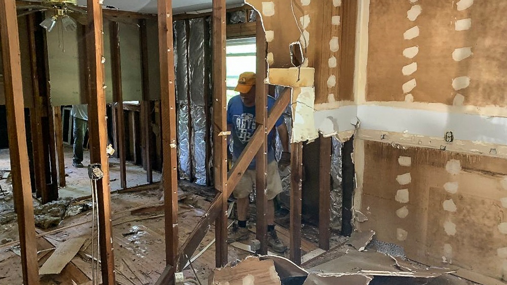 Damaged Walls Come Down With Help From Volunteers
