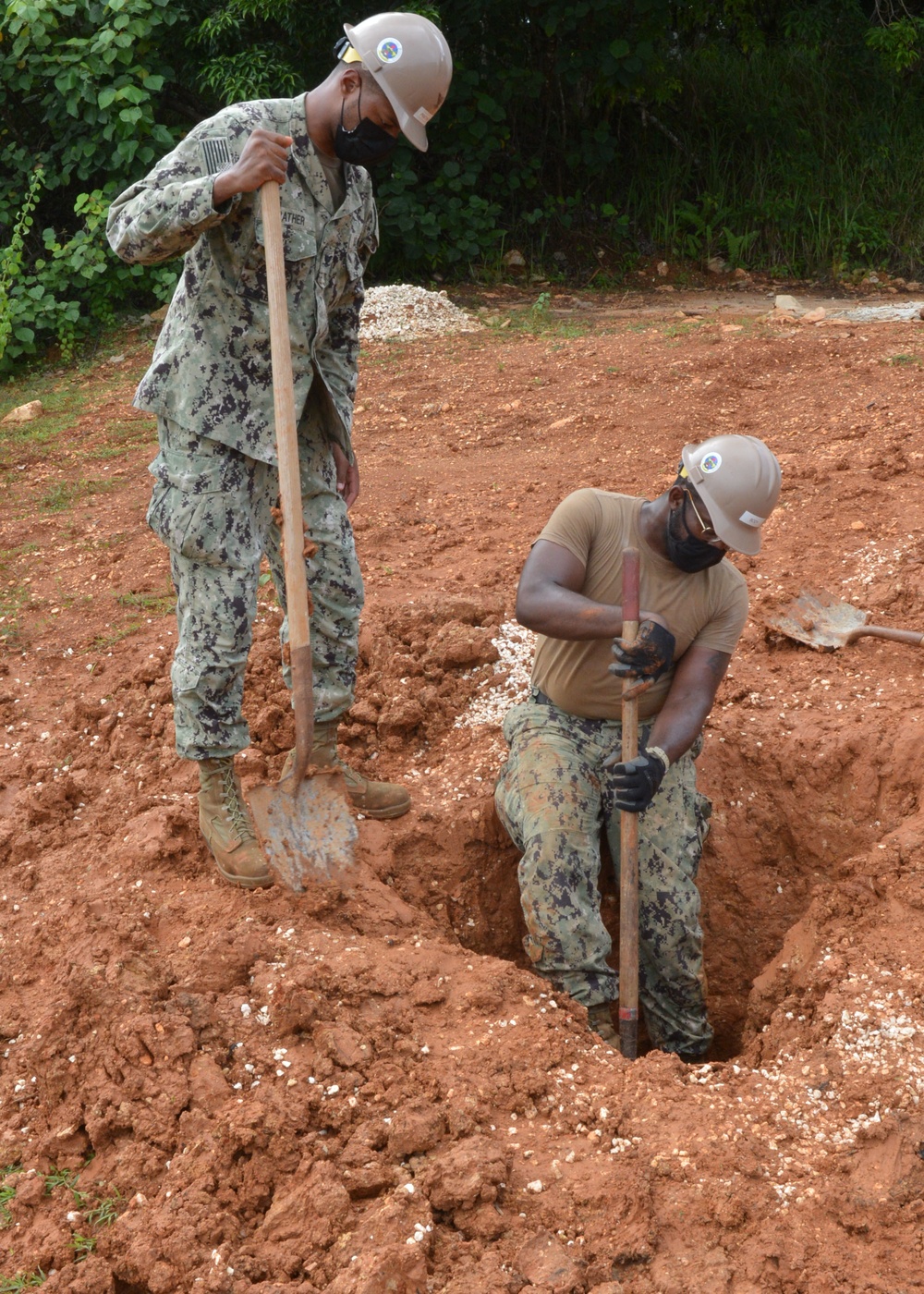 NMCB One DET Guam Seabees make progress on the Outhouse project