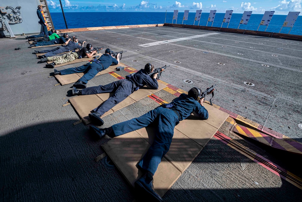 Sailors assigned to the forward deployed amphibious assault ship USS America participate in rifle qualifications.