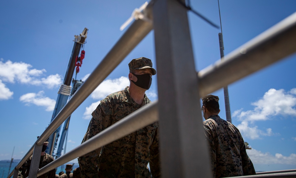 US Marines and Sailors debark USS America