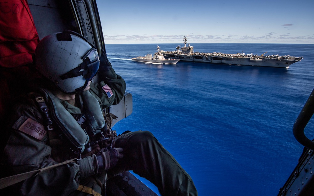 Sailor Observes USS Dewey (DDG 105) and USS Carl Vinson (CVN 70) Transit