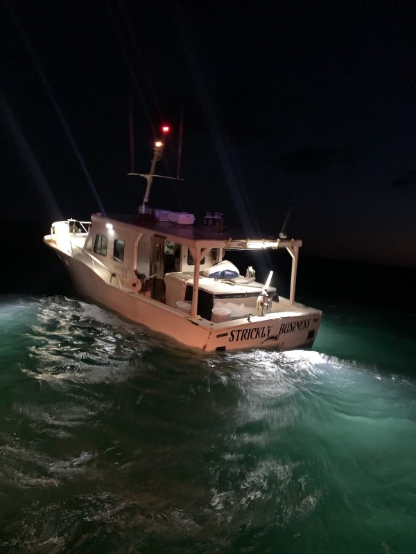 Coast Guard rescues 2 from vessel on fire and taking on water 9 miles off Bulls Bay