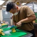 USS Carl Vinson (CVN 70) Sailor Prepares Food