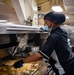 USS Carl Vinson (CVN 70) Sailor Prepares Food