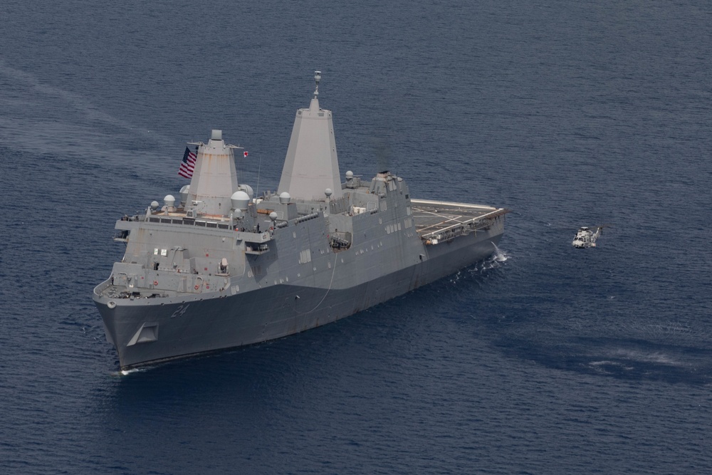 Dutch Helicopter Flies Alongside USS Arlington