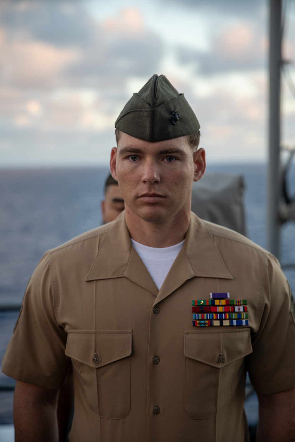 U.S. Marines, Sailors aboard USS Pearl Harbor honor fallen Sailor with memorial